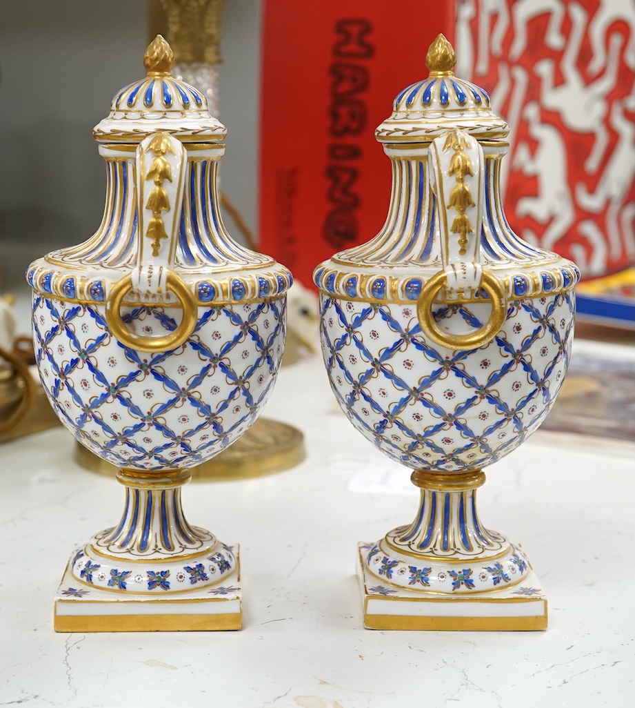 A pair of early 20th century Sevres style vases and covers, 21cm. Condition - good